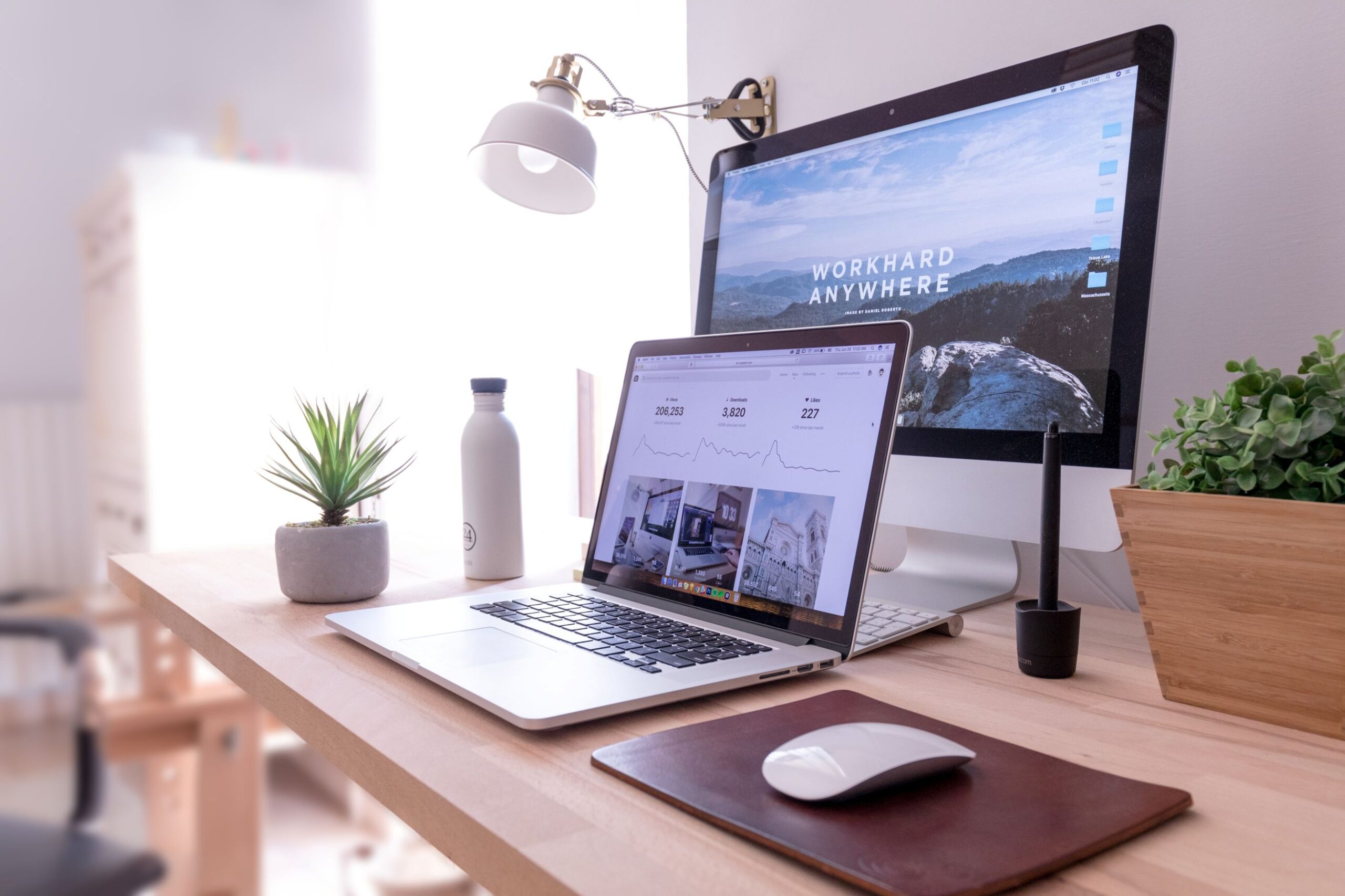 A computer monitor with a laptop in front